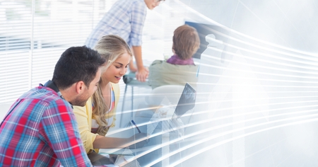 Digital composite of Millennial innovative team in office and white interface transitionの写真素材