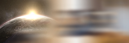 Digital composite of Sun rising over planet earth with blurry brown transitionの写真素材