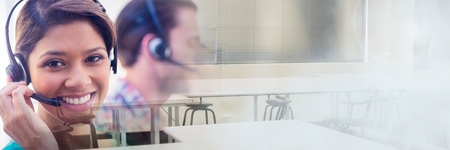 Digital composite of Customer service assistants with headsets  with bright background