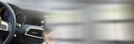 Digital composite of GPS and steering wheel in car with transition effect and copy spaceの写真素材