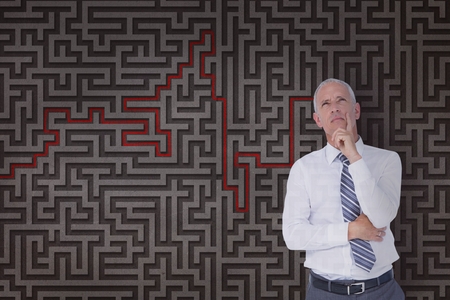 Digital composite of Man thinking against a maze background 3dの写真素材