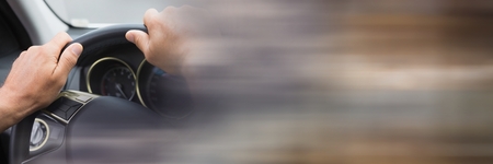 Digital composite of Holding steering wheel in car with transition effect and copy spaceの写真素材