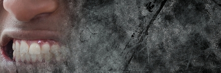 Digital composite of Close up of frustrated man's mouth and grey grunge transitionの写真素材