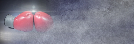 Digital composite of Boxing gloves with grunge copy space transition