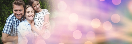 Digital composite of Family smiling with purple bokeh transitionの写真素材