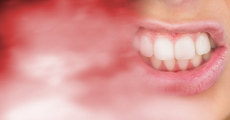 Digital composite of Close up of frustrated woman's mouth and blurry red copy space transitionの写真素材