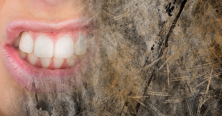 Digital composite of Close up of frustrated woman's mouth and brown grunge transitionの写真素材
