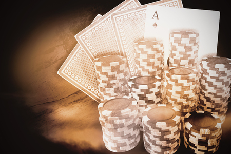 Computer generated 3D image of gambling chips against thunderstrom over cityscape