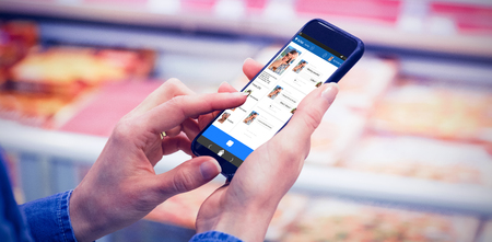 3D interface of chat application against cropped image of man using mobile phoneの写真素材