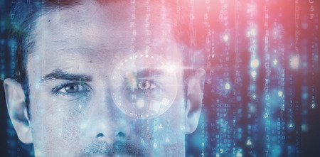 3D image of close up portrait of serious young man against digitally generated black and blue matrix