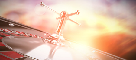 3D image of ball on roulette wheel against glowing backgroundの写真素材