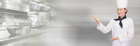 Digital composite of Chef in kitchen with blurred backgroundの写真素材