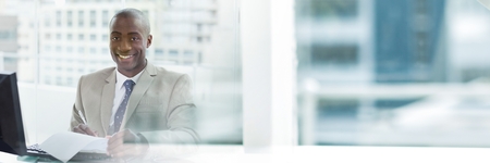 Digital composite of Man Signing Paper Agreement with city windows transitionの写真素材