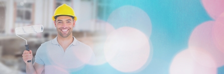 Digital composite of Painter on building site with sparkling lights bokeh transition effectの写真素材