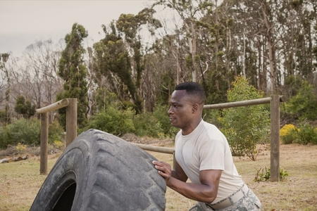 Digital composite of Soldier man pushing a wheelの写真素材