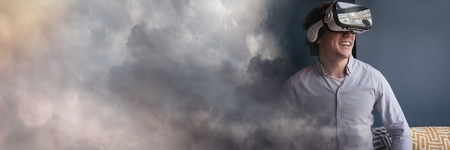 Digital composite of Man Wearing VR Headset with dark clouds transition