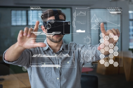 Digital composite of Man in VR headset touching interfaces