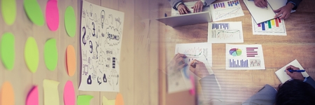 Digital composite of Business people having a meeting with colorful sticky notes transition effectの写真素材
