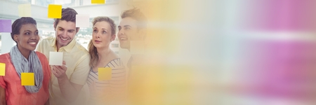 Digital composite of Millennial team looking at sticky notes with blurry sticky notes transition