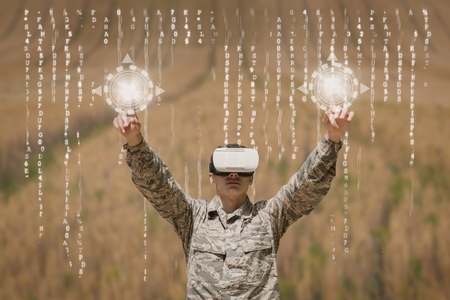 Digital composite of Military man in VR headset touching interfaces against field background with...
