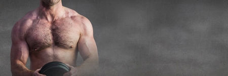 Digital composite of Strong healthy man holding weightの写真素材