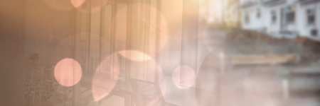 Digital composite of Construction Worker with pen chart in front of construction siteの写真素材