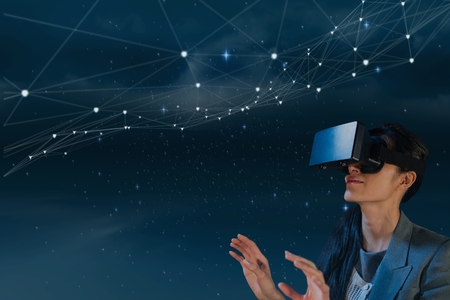 Digital composite of Woman in VR headset looking at stars against blue background