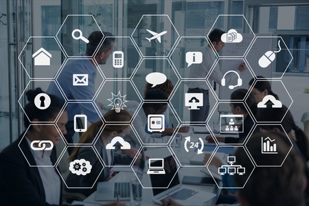 Digital composite of Icons against meeting background