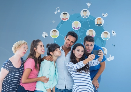 Digital composite of Group of people taking selfie in front of world globe graphicsの写真素材