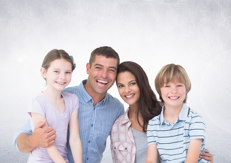 Digital composite of Happy Family in front of grey backgroundの写真素材