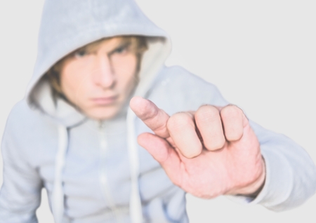 Digital composite of Portrait of Man wearing hoodie with grey background