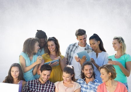 Digital composite of Group of students reading in front of grey backgroundの写真素材