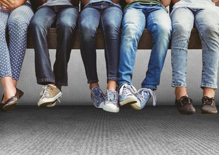 Digital composite of Group of people's legs sitting on bench in front of grey background