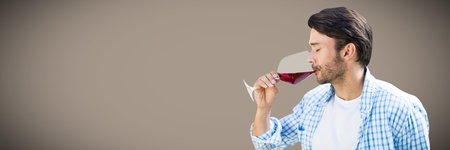 Digital composite of Man tasting wine against brown background