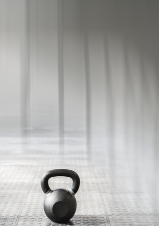 Digital composite of Kettlebell in Gym with transitionの写真素材