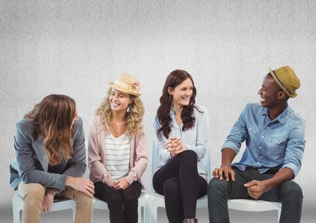 Digital composite of Group of people sitting in front of grey backgroundの写真素材