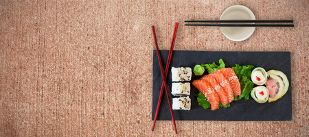 Close up of japanese food with chopsticks against weathered surfaceの写真素材