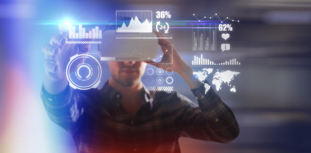 Man using virtual reality glasses while gesturing against blur view of office corridor and workspace