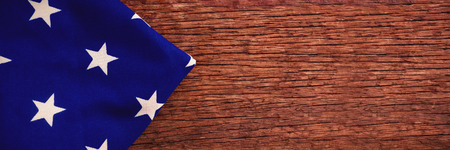 Close-up of American flag on a wooden tableの写真素材