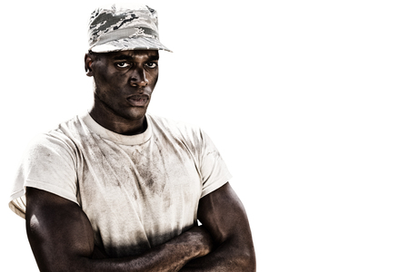 White background with vignette against portrait of military soldier with crossed armsの写真素材