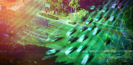 Stocks and shares against blurred motion of vehicles on street