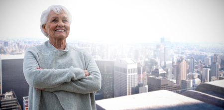 Portrait of retired women  against high angle view of cityの写真素材