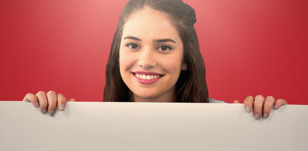 Women with banner against pink backgroundの写真素材