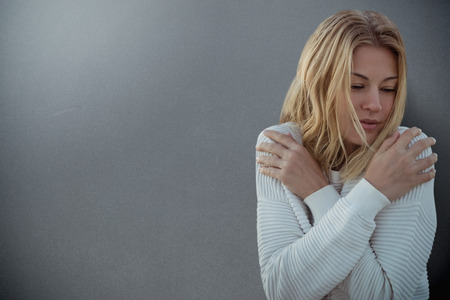 Portrait of beautiful blonde women  against grey backgroundの写真素材