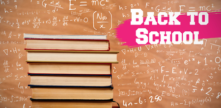 Back to school message against hardcover books stackの写真素材