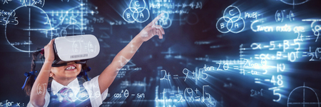 Digitally composite image of mathematical equations with diagram against schoolgirl using virtual reality headset against blackboardの写真素材