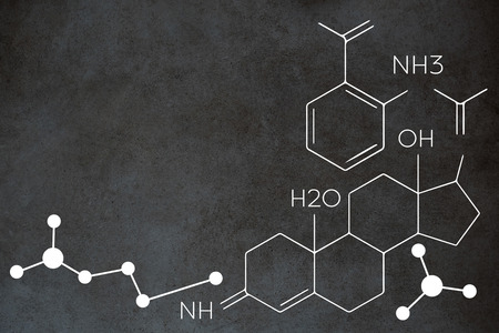 Composite image of chemical structure against close-up of blackboardの写真素材