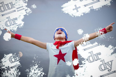 Little boy dressed as superman against scenic view of moonの写真素材