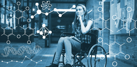 Illustration of chemical formulas against disabled schoolgirl on wheelchair in corridor at schoolの写真素材