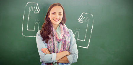 Casual woman against green chalkboardの写真素材